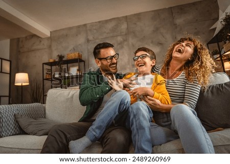 Similar – Image, Stock Photo Happy family on a camping trip relaxing in the autumn forest. Camper trailer. Fall season outdoors trip