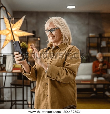 Similar – Image, Stock Photo Cheerful woman having video call
