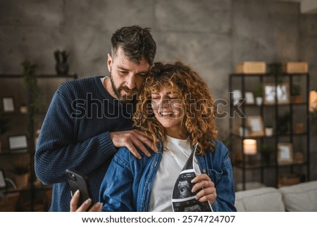 Similar – Image, Stock Photo Delighted couple hugging during sunset in nature