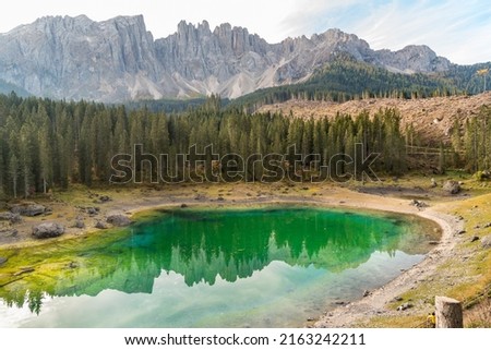 View of a small alpine Lake Carezza o Karersee located in Nova Levante, province of Bolzano in Dolomites, South Tyrol, Italy Foto stock © 