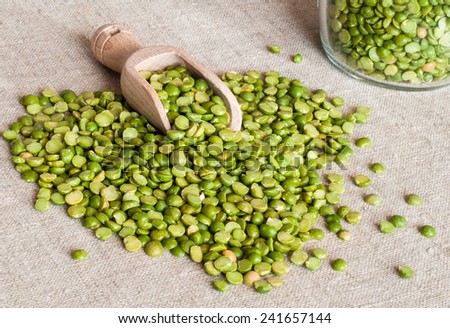 Dried peas broken on wooden spoon