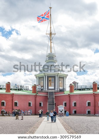 SAINT PETERSBURG, RUSSIA - JUNE 17, 2015: Naryshkin Bastion and Flag Tower  of Peter and Paul Fortress on Neva River.
