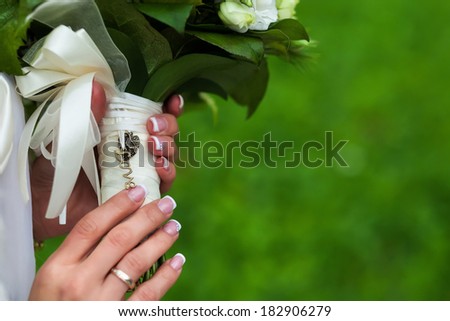 wedding bouquet in hands. inscription love. close-up