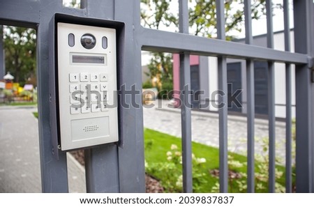 Video intercom on the gate at the entrance to the residential area. Electronic intercom to a private area. closed residential yard