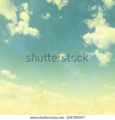 Blue sky with white clouds in grunge style.