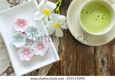 coconut milk jelly and Matcha green tea latte on wood background