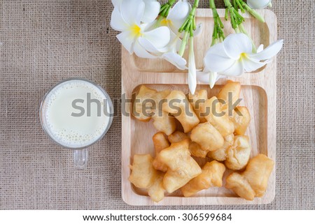 Dry soya (soy) beans with glass of soya milk with fried bread stick