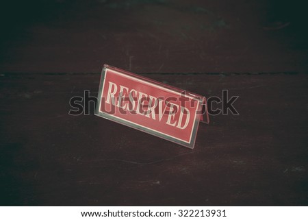 Reserved sign on a table in restaurant, Vintage Style.