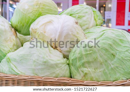 Close up of  iceberg lettuce being sold at a farmer's market, i n a pile. Stock fotó © 