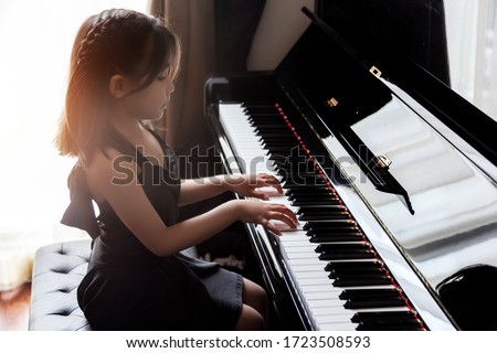 Similar – Image, Stock Photo Child practicing piano