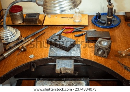 Similar – Image, Stock Photo Jeweler with hammer and chisel creating jewelry in workshop