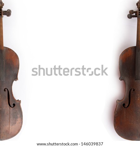 Old broken violin isolated on the white background