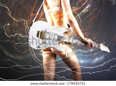 Guitar player with white electric guitar surrounded by lightnings