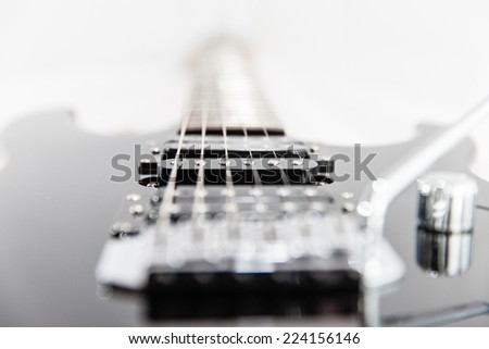 Electric Guitar strings and pickup closeup