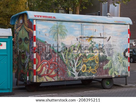 Rotterdam, Netherlands - October 16, 2012: The car trailer from graffiti on the walls, standing on the street of Rotterdam, Holland