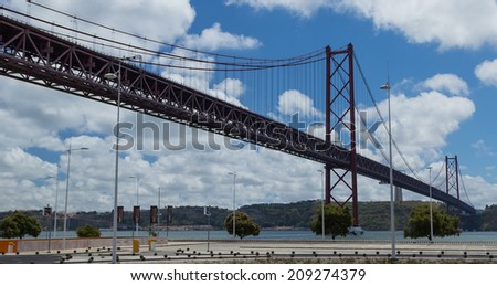 Lisbon, Portugal - August 14, 2013: The bridge on April 25 (Ponte 25 de Abril) through the river Tagus in Lisbon, Portugal