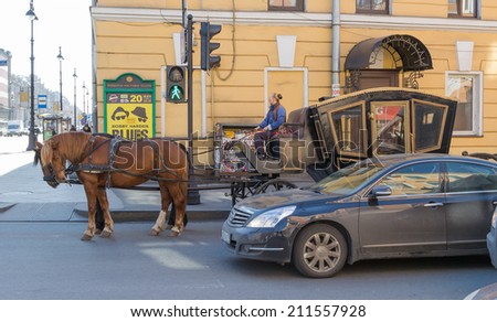 Saint Petersburg, Russia - April 28, 2012: The car and horse crew stand on the traffic light in Saint Petersburg