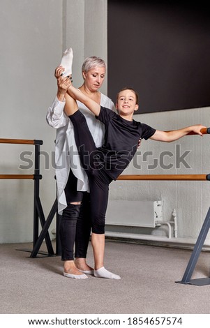 Similar – Image, Stock Photo Dance training of a woman in dance studio | reflection in background in black and white