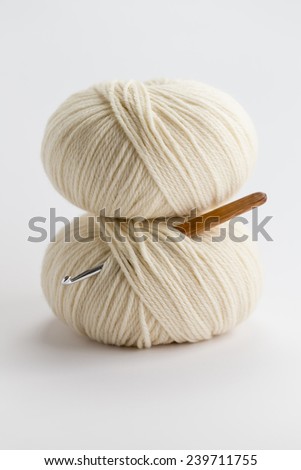 Ball of wool yarn with crochet hook