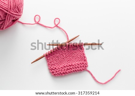 Incomplete knitting project with wooden needles