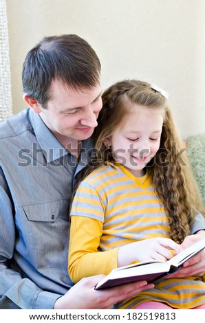 the father and the daughter read the book