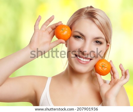beautiful woman with tangerines