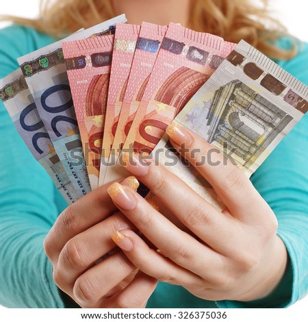 Woman holding money fan