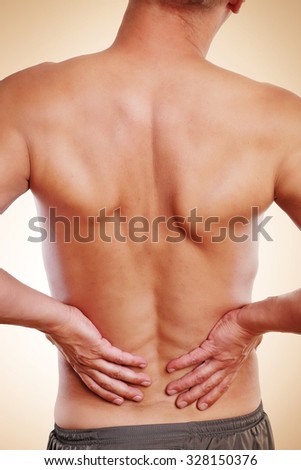 Man has pain in the lumbar region