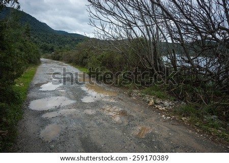 Season of bad roads. Spring roads after heavy rain at Evbia, Greece