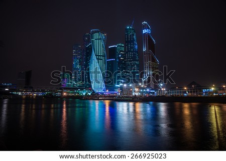 Picturesque night view of the Moscow City across the river Moscow with reflection in water, Moscow, Russia