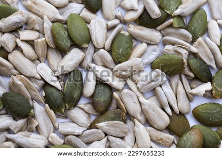 mixed pumpkin seed and sunflower seeds on white background. super food concept. Imagine de stoc © 
