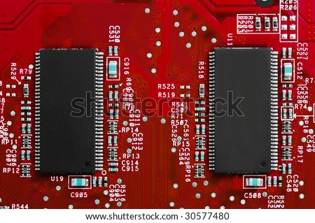 Power of technology: two chips on red circuit board