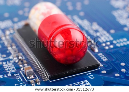 To heal and to protect: medical technology concept made of pill and computer board