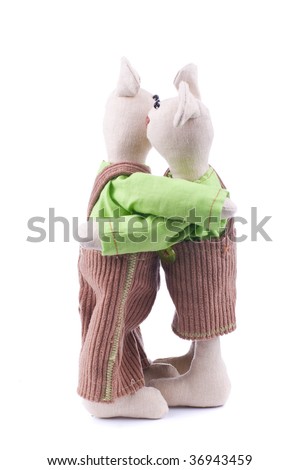 Toy love - two fabric mice hug one another