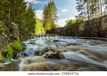 The river with a rapid current in the summer, Russia, Ural Mountains