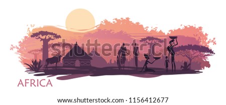 Sunset in Africa with the silhouettes of national housing, baobabs, acacia, wildebeest and natives
