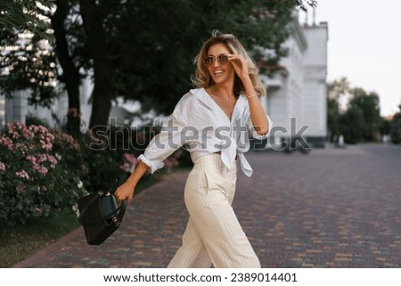 Similar – Image, Stock Photo Woman in stylish outfit leaning on handrail at staircase