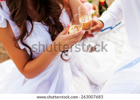 Summer holidays and dating  mood . Couple  in love drinking champagne  and clink glasses. Man and woman have romantic picnic.