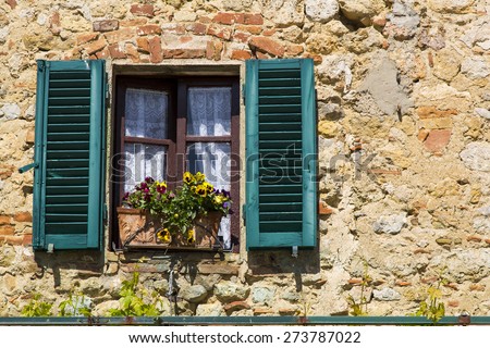 view from a window of an old house in a Tuscan village