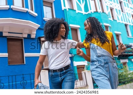 Similar – Image, Stock Photo A cool couple chatting in a beach in the sunset time