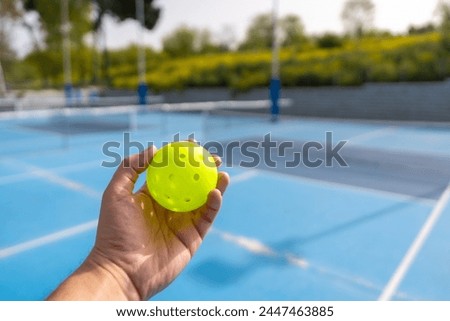 Similar – Image, Stock Photo Hand holds a yellow arrow with the word luck on it against a neutral turquoise background. Way to happiness.