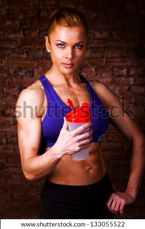 strong woman with sports nutrition