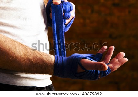 Portrait Of Fighteris Applying Bondage Tape On Hands Stock Photo ...