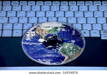 Earth are reflected in the CD on the notebook keyboard.