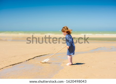 Similar – Image, Stock Photo Children playing with fishing rod toy in a pool in a home garden