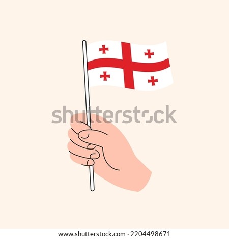 Cartoon Hand Holding Georgian Flag, The Flag of Georgia, Concept Illustration. Flat Design Isolated Vector.