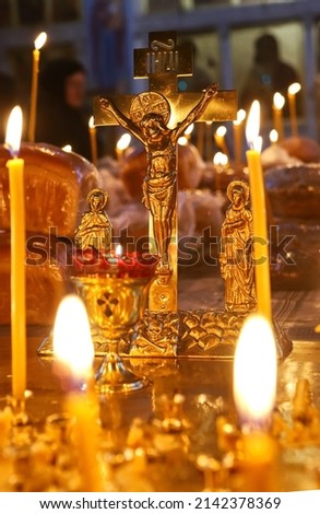 Funeral service, funeral liturgy in the Orthodox Church. Christians light candles in front of the Orthodox cross with the crucifix, the concept of Orthodox faith and religion. Stock foto © 