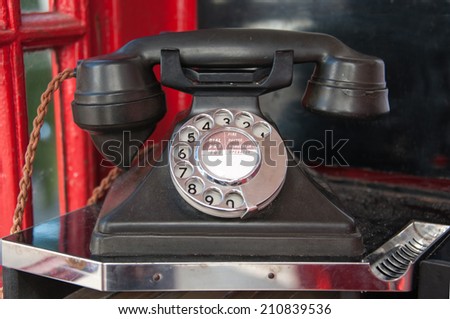 British vintage telephone in a telephone kiosk