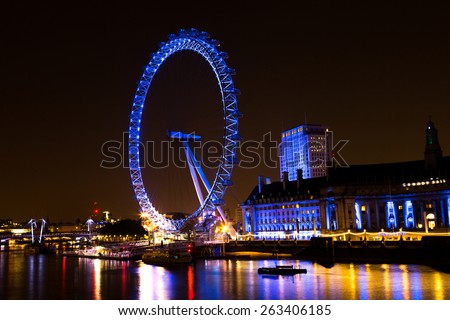 LONDON, ENGLAND - JUNE 1st, 2014 - The London Eye on the South Bank of the River Thames at night.