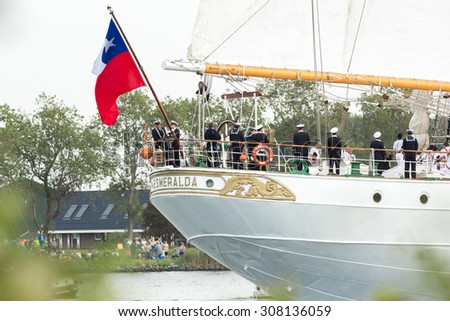 AMSTERDAM, THE NETHERLANDS, AUGUST 19, 2015: Chilean flag at the stern of the barquentine tall ship Esmeralda of the Chilean Navy during the Sail-In parade in Amsterdam on August 19th, 2015.